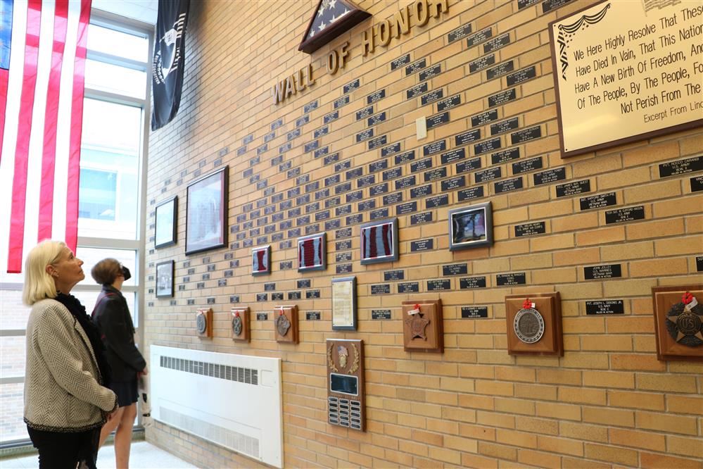  People looking at the Pennsbury Wall of Honor